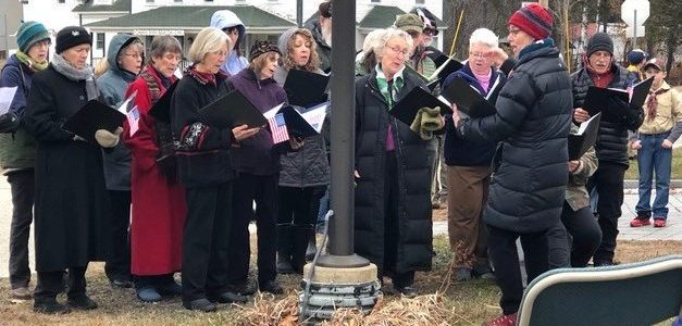 Photo os singers outdoors.